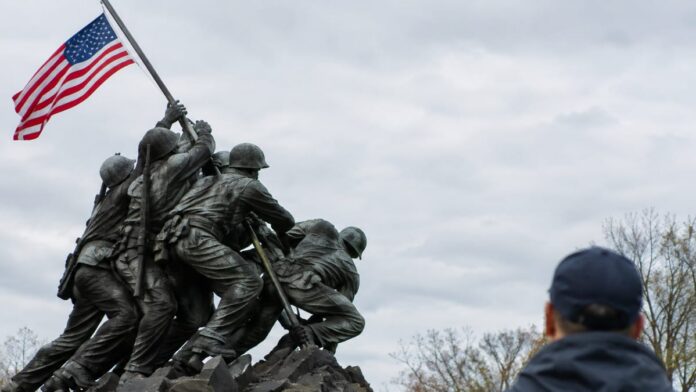 wp-d863abd1-9313-4f94-aa4a-1081a3f7a368 AI-generated illustration: Feds Charge Iwo Jima Statue Suspect as Judge Sets $2,500 Bond